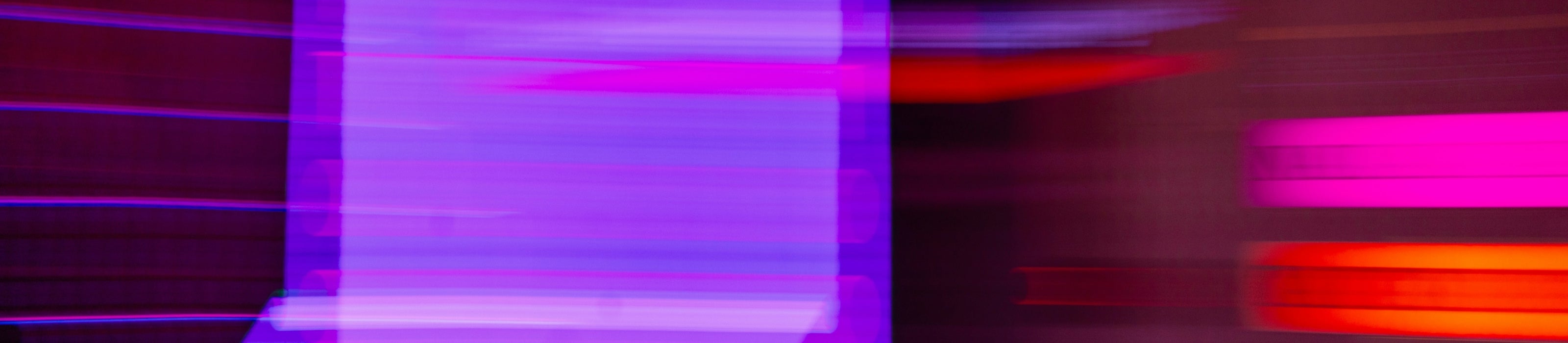 Abstract design with purple and orange colors on a dark background