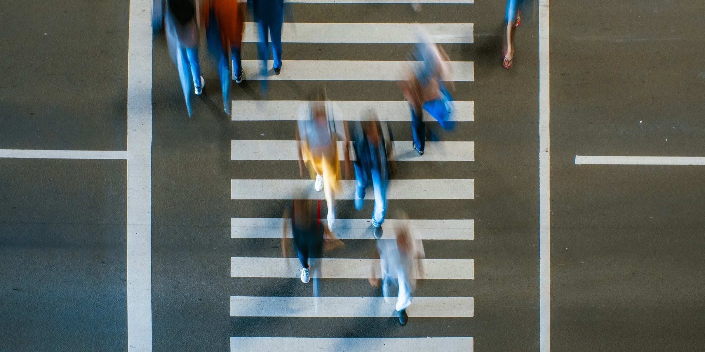 People walking across the walk lane